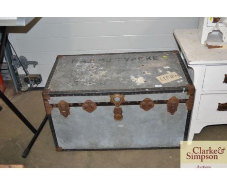 A metal travelling trunk