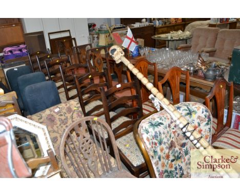 A set of six oak ladder back dining chairs