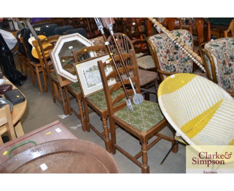 A set of four ladder back dining chairs