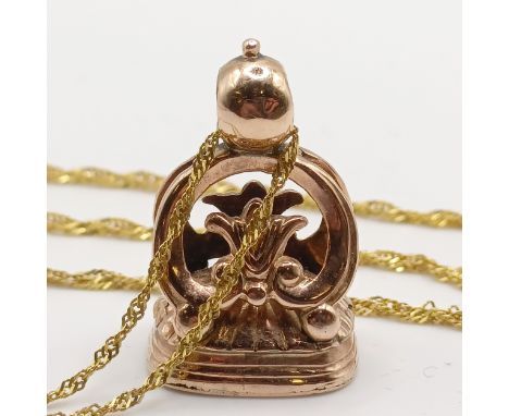 A yellow metal and hardstone seal, on a 9ct gold chain