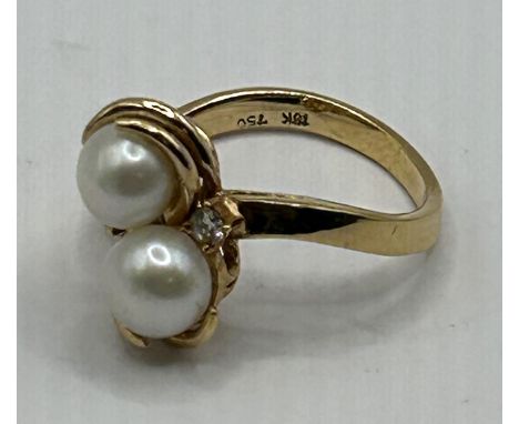 An 18ct gold, cultured pearl and diamond crossover ring