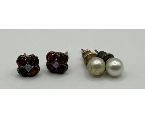 A pair of opal and garnet stud earrings, and a pair of pearl stud earrings (2)