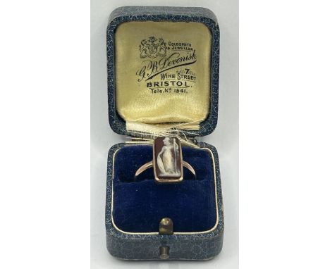 A yellow metal cameo plaque ring, ring size P, in a vintage jewellery box