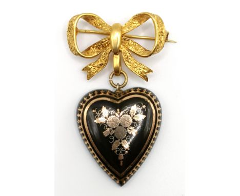 An 18ct gold bow pendant, with a heart shaped pendant, 12.9 g all inWidth 2.4 cmLength 5 cm
