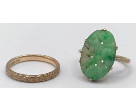 A 9ct gold wedding band, ring size M, 1.9 g, and a yellow metal and carved green stone ring, ring size L