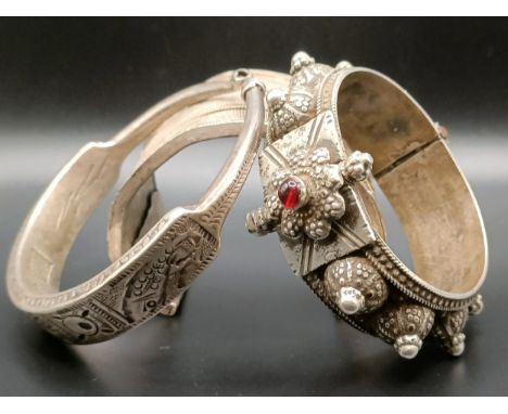 An Eastern silver coloured bangle and two others, 267 g (3)