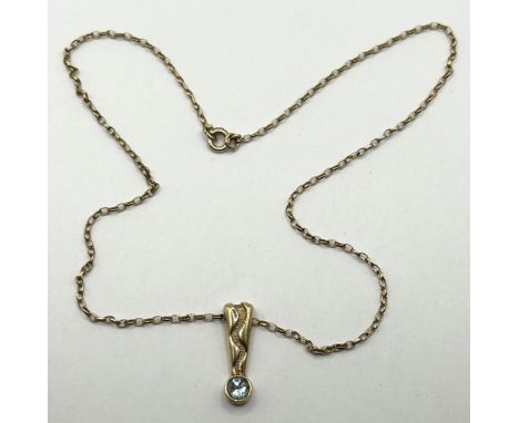 A 9ct gold and aquamarine pendant, on a 9ct gold chain, 4.1 g (all in)
