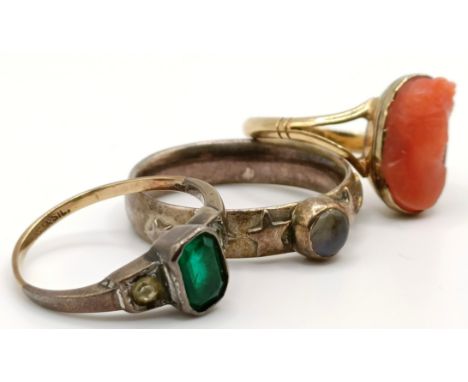 A 9ct gold and silver dress ring, a yellow metal and carved coral intaglio ring and a silver and moonstone ring (3)