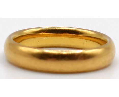 A 22ct gold wedding band, ring size N, 5.7 g