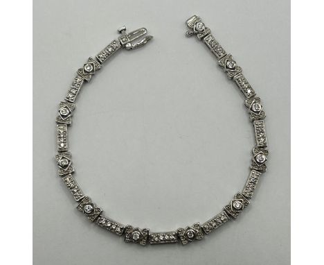 A silver and white stone tennis bracelet