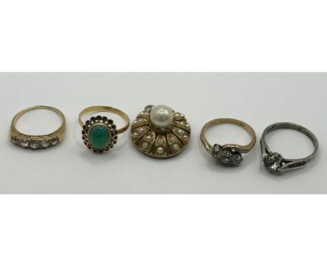 A 9ct gold and diamond five stone ring, three dress rings and a brooch