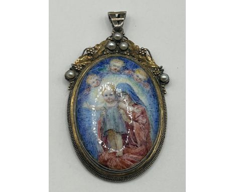 An Arts & Crafts enamel pendant, decorated The Virgin & ChildSize of enamel excluding frame 36 mm
