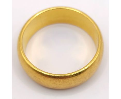 A 22ct gold wedding band, ring size O, 9.2 g7 mm depth