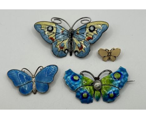 A silver and enamel butterfly brooch, makers mark TM, 60 mm wide and three other butterfly brooches (4)