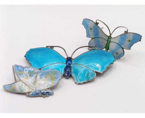 A silver and enamel butterfly brooch, J Atkin &amp; Son, 70 mm wide, a silver and enamel butterfly brooch, 50 mm wide, and a 