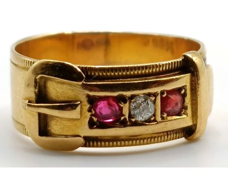 An 18ct gold, diamond and ruby buckle ring, ring size N, 4.7 g (all in)General wear as you'd expect with use and age, no majo