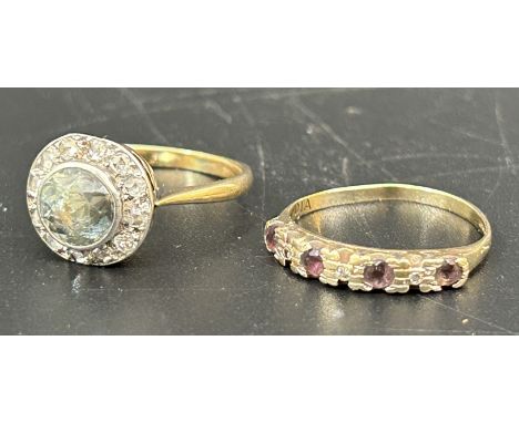 A blue and white zircon ring, ring size K and a 9ct gold and amethyst ring, ring size J (2)