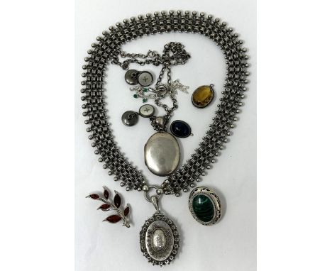 A Victorian silver locket, Birmingham 1886, on a chain, a malachite brooch, and other jewellery