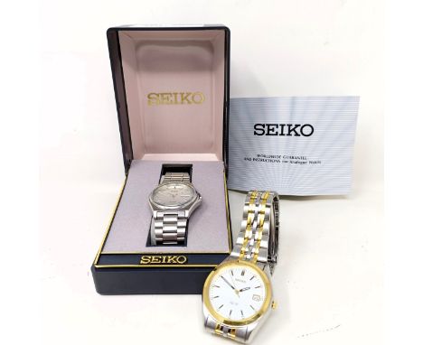 A gentleman's stainless steel Seiko SQ100, cased with instructions and guarantee booklet, and a gentleman's stainless steel S