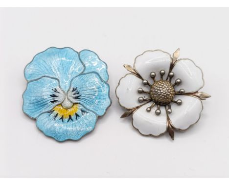 A sterling silver and enamel floral brooch, 35 mm wide, and another 35 mm wide (2)