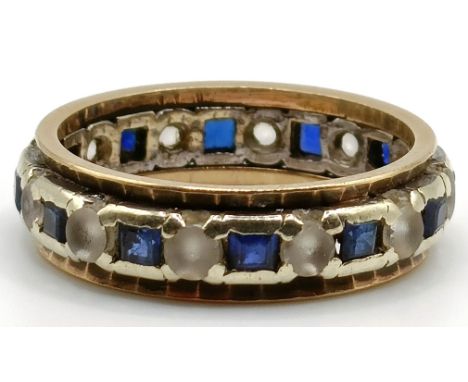 A 9ct white and yellow gold eternity ring, ring size M