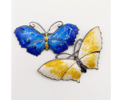 A silver and enamel butterfly brooch, 55 mm wide, and another, 55 mm wide (2)