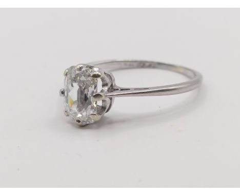 A platinum and oval cut diamond solitaire ring, ring size K