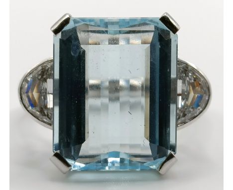 A white coloured metal, emerald cut aquamarine and diamond ring, with spacers, ring size K10 g all inaquamarine 16 x 12 mm