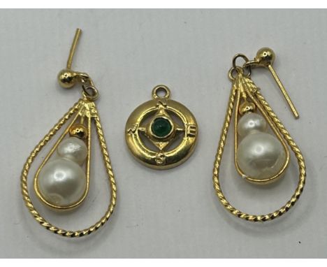 An 18ct gold and cabochon cut emerald compass pendant, 1.9 g (all in), and a pair of yellow metal and cultured pearl drop ear