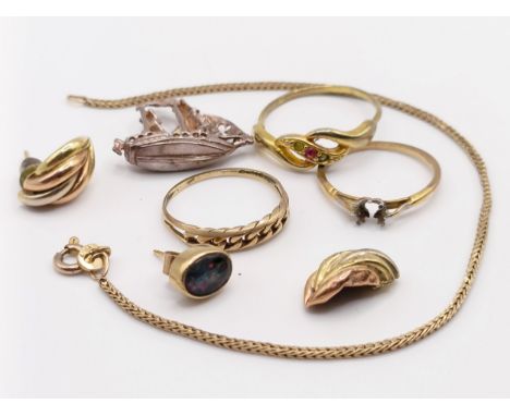 A 9ct gold ring, ring size M, a 9ct gold bracelet, 2.4 g, a single opal earring, a pair of gilt metal earrings, a 9ct gold ri
