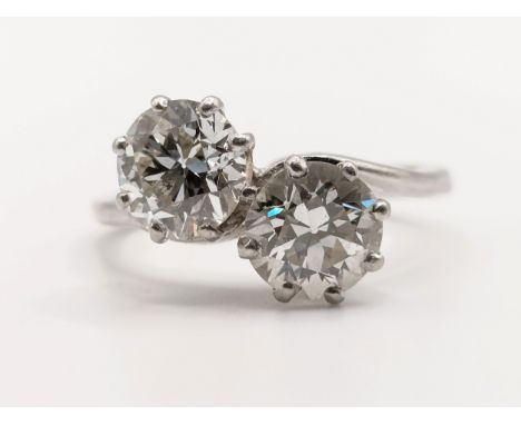 A two stone diamond crossover ring, each diamond 1.2ct to 1.3ct approx.Ring size P. Stones are matched well, No visible inclu