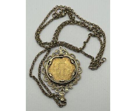 A Victorian shield back sovereign, 1861, in a yellow metal pierced mount, on a chain, 22.5 g (all in)