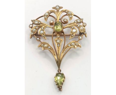 An early 20th century 9ct gold, peridot and seed pearl pendant/brooch, 35 x 55 mm approx.