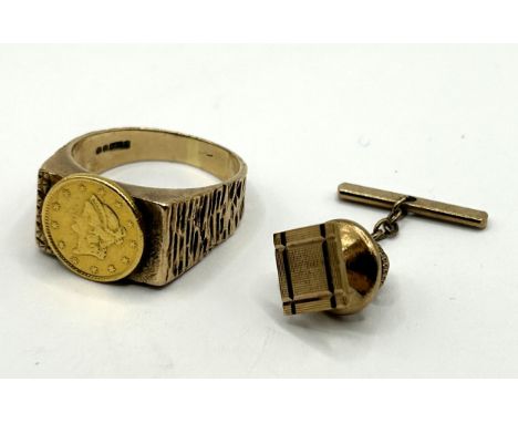 A 9ct gold signet ring, with an applied American gold coin, ring size T, 7.3 g all in, and a gold plated tie pin