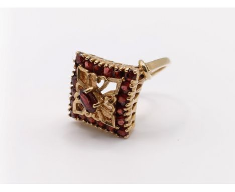 A 9ct gold and garnet cluster ring, ring size I