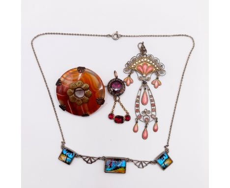 An Art Nouveau style pendant, a necklace, a purple stone pendant, and a red hardstone brooch (4)