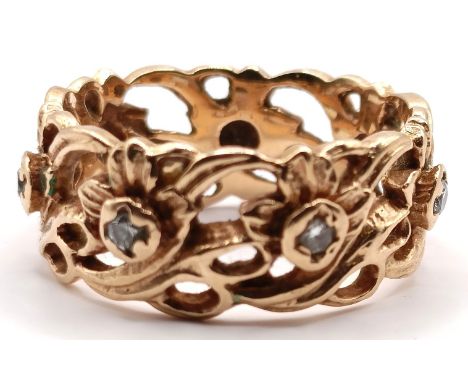 A 14ct gold and diamond band ring, with pierced floral decoration, ring size P, 6.5 gOverall condition good, no major faults 
