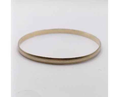 A 9ct gold bangle, 7.9 g
