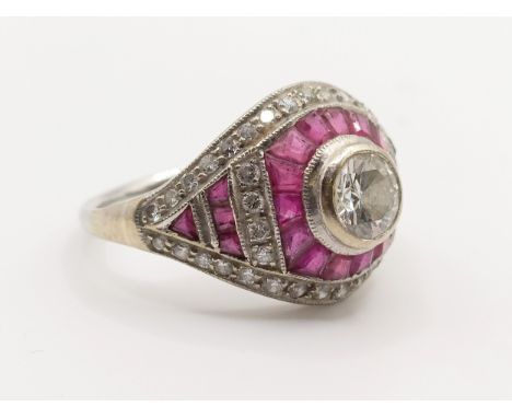 An Art Deco style diamond and ruby target style ring