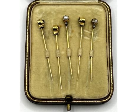An unusual set of five gem set lace pins, in a Rowlands &amp; Frazer fitted box