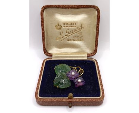 A 9ct gold carved green and purple stone and cultured pearl floral brooch, makers mark WB, 38 mm wide, in a vintage box