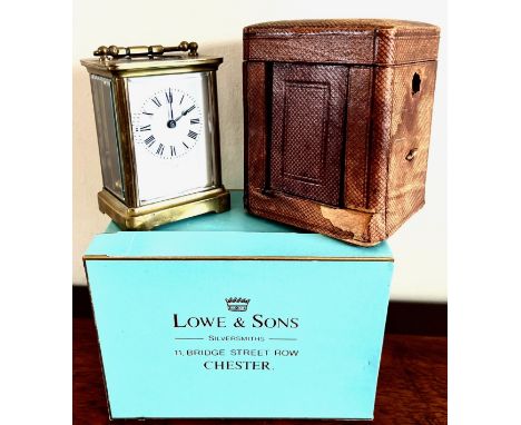 BRASS CARRIAGE CLOCK WITH ORIGINAL LEATHER CASE AND FRONT PANEL