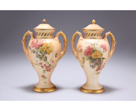 A PAIR OF ROYAL WORCESTER BLUSH IVORY POT POURRI VASES AND COVERS, of two-handled baluster form, painted with flowers, shape 