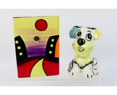Lorna Bailey - A dog figure Woof Woof, 12.5 cm (h) and a Manhattan pattern ceramic mantel clock (lacking movement), both sign