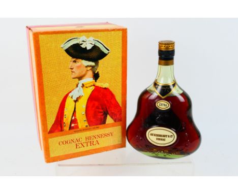 Cognac - One bottle of Hennessy Extra, 70° Proof, Not Less Than 24 fl ozs, contained in carton, level mid-shoulder, a 1970's 