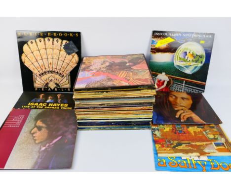 A collection of 12" vinyl records to include Bob Marley, UB40, Procol Harum, Bob Dylan, Status Quo, Isaac Hayes and other. [W