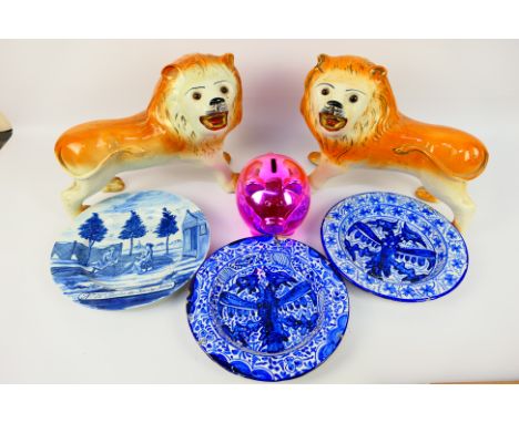 A pair of ceramic lions, approximately 25 cm (h) and a small quantity of blue and white Delftware ceramics, 18th century or l