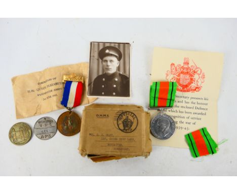 A World War Two (WW2 / WWII) Defence medal contained in box of issue addressed to Mr S H Wort with accompanying photograph, 1