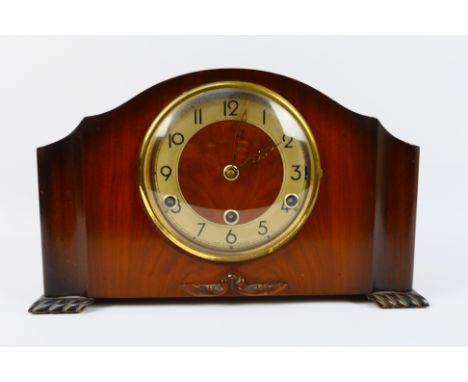 A Bentima mantel clock, with pendulum. [W]