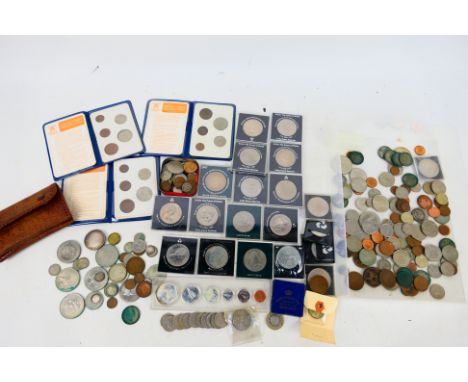 A collection of coins and commemoratives, Victorian and later, some silver content noted. [W]